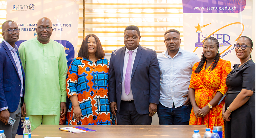 (L-R): MobileMoney LTD's Solomon Hayford, Head of Business Intelligence and Analytics, CEO Shaibu Haruna, and Chief Finance Officer Susan Yawson join ISSER and ReFinD representatives Prof. Peter Quartey, Prof. Francis Annan, Adadzewa Otoo, and Mawuena Akuamoah-Boateng after the partnership agreement signing ceremony.