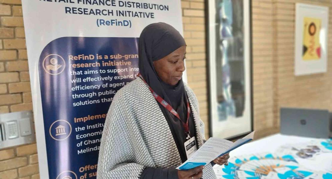 Dr. Farida Mohammed Shebu, Bayero University, Kano, Nigeria, with a research focus on improving financial inclusion for Muslim women spends time at the ReFinD stand.