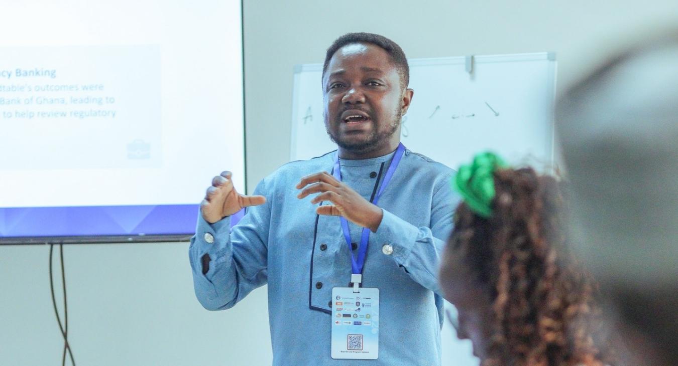 Post-doctoral Fellow Dr Daniel Osafo presents ReFinD’s research insights during the Private Sector Evidence-Based Decision-Making (EBDM) Lab at E2A2026.