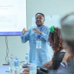 Post-doctoral Fellow Dr Daniel Osafo presents ReFinD’s research insights during the Private Sector Evidence-Based Decision-Making (EBDM) Lab at E2A2026.